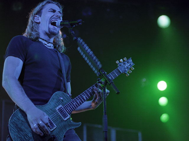 Chad Kroeger of the band Nickleback, playing their special kind of Butt Rock to a live audience